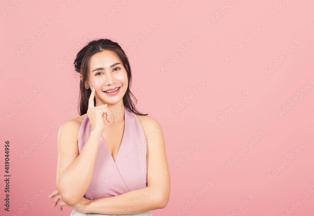 Portrait Asian beautiful young woman smiling standing chin handle relaxed thinking about something about the question studio shot isolated on pink background, Thai female idea think with copy space Portrait Asian beautiful young woman smiling standing chin handle relaxed thinking about something about the question studio shot isolated on pink background, Thai female idea think with copy space
