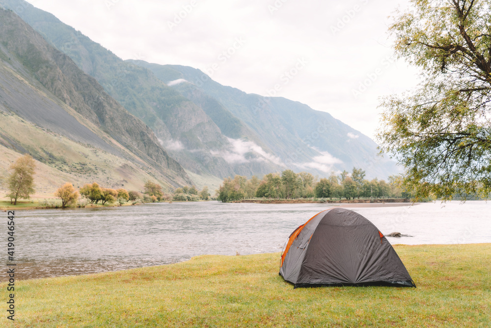 hiking tent on the beach of river