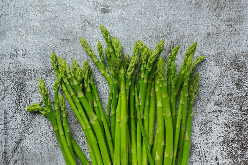 fresh green asparagus on old dark background