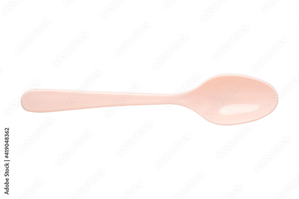 Pink plastic spoon in isolated with clipping path.Plastic kitchen utensils. Pink plastic spoon in isolated with clipping path.Plastic kitchen utensils.