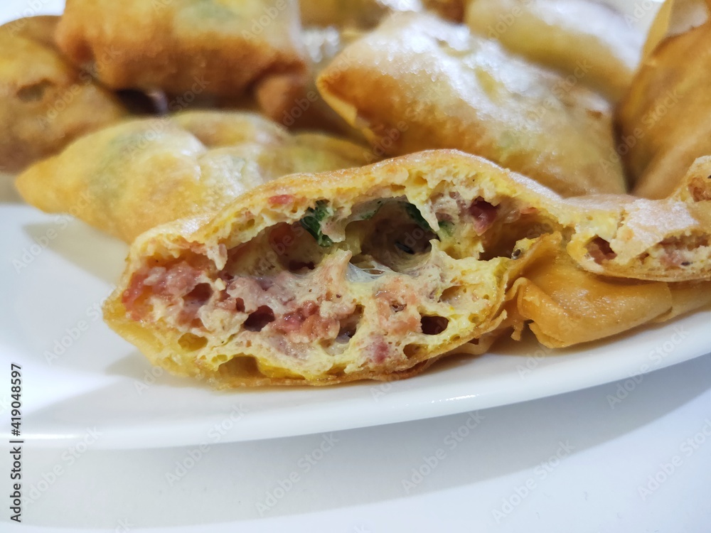 Martabak Telor Mini in Whitw Plate. is Traditional Food From Indonesia Martabak Telor Mini in Whitw Plate. is Traditional Food From Indonesia