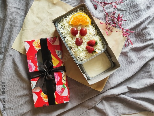Fruit Salad With Cheese, Strawberry, Grape and Orange in a Box. photo