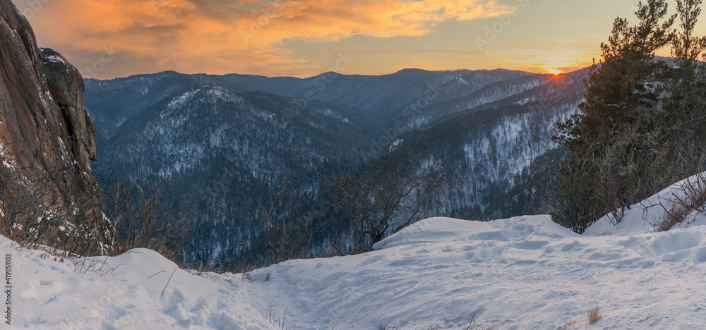 Beautiful winter panorama of mountains at sunset
