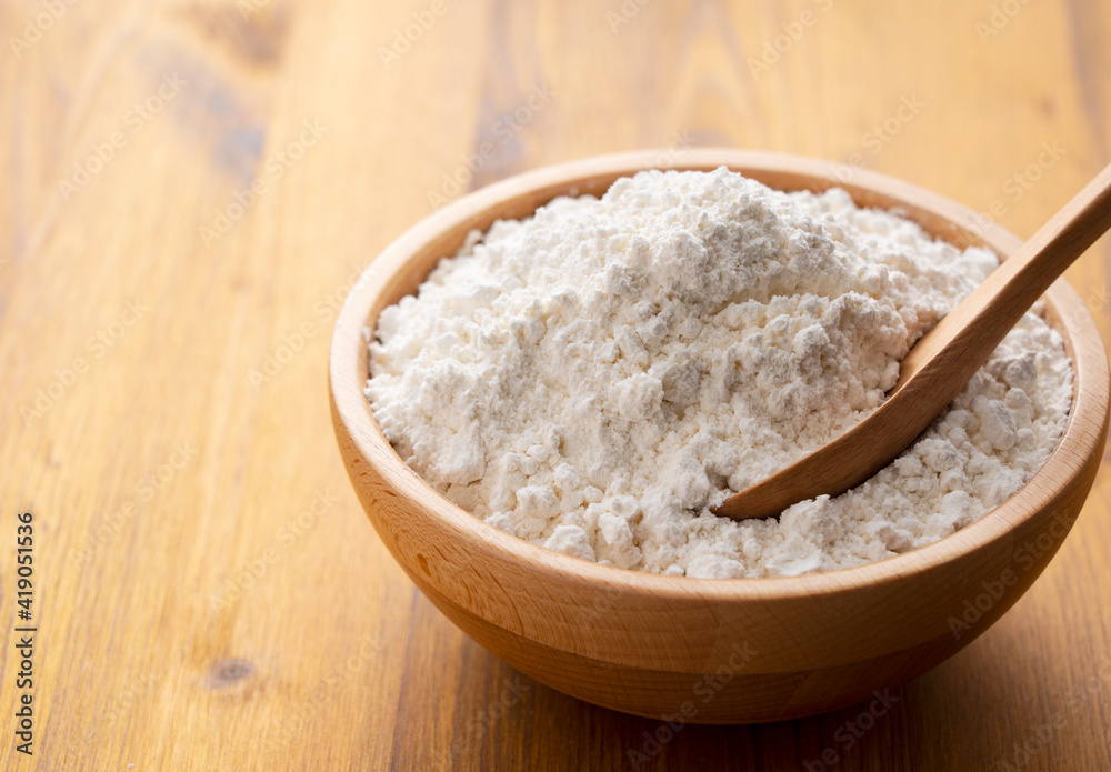 Flour placed on a wooden background
