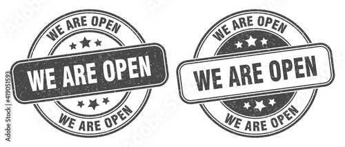 we are open stamp. we are open label. round grunge sign