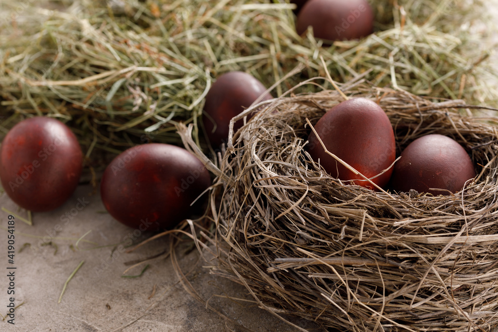 Still life many colorful easter eggs on a textural background. Rustic. Decoration from natural herbs. Easter celebration concept. Still life many colorful easter eggs on a textural background. Rustic. Decoration from natural herbs. Easter celebration concept.