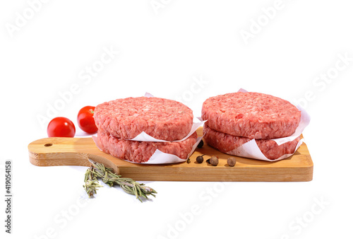 Raw beef patties for making a burger.Isolated on a white background.Selective Focus.