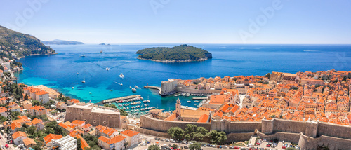 Aerial Panorama drone shot of Lokrum island in Adriatic sea by Dubrovnik old town in Croatia sunny summer © Davidzfr