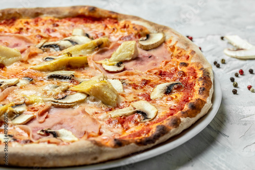 capriciosa pizza. Italian pizza is cooked in a wood-fired oven. banner, menu recipe. top view