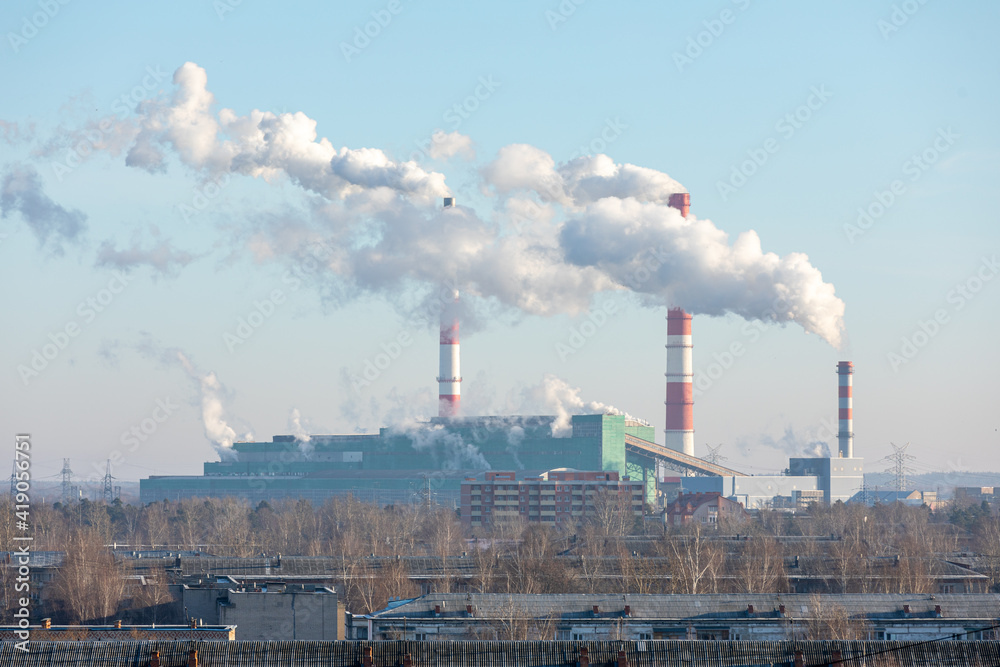 Air pollution from a natural gas and coal power plant. Emissions of harmful substances into the atmosphere. Traditional hydrocarbon energy. Electricity and heat production. Ecological concept. Air pollution from a natural gas and coal power plant. Emissions of harmful substances into the atmosphere. Traditional hydrocarbon energy. Electricity and heat production. Ecological concept.