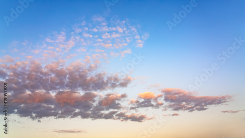 Clouds on sunset sky background