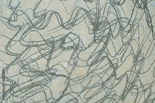 Curved pattern created by digging the surface of the cement face. for background and textured.
