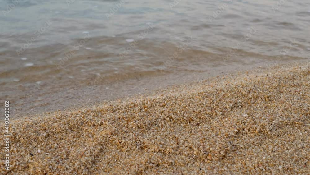Waves water seashore on sand beach. Natural relax paradise. Travel in tropical climate at summer Surface of sea or ocean Waves water seashore on sand beach. Natural relax paradise. Travel in tropical climate at summer Surface of sea or ocean