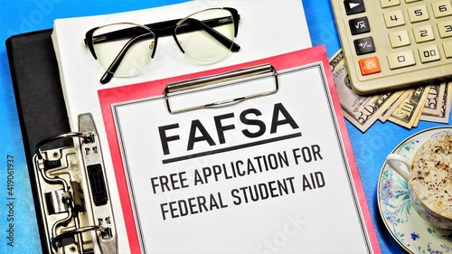 FAFSA. Free application for federal student aid. A text label in the planning folder. Financial assistance in the form of grants, loans and funds for work and study. photo