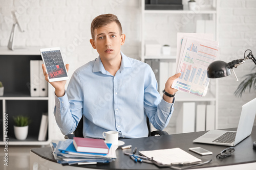 Stressed businessman trying...
