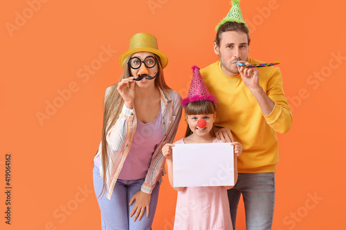 Young family in funny disgu...