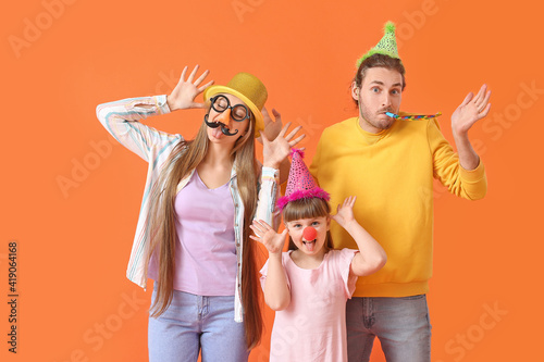 Young family in funny disgu...