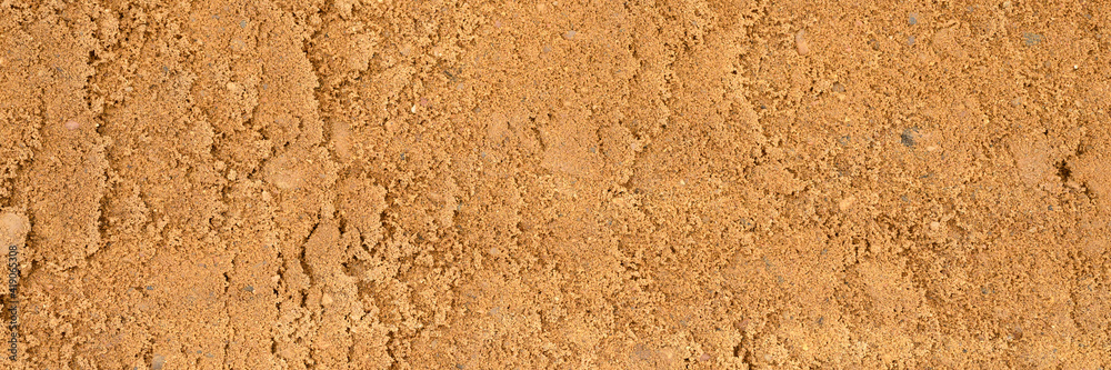background texture from the smooth surface of the sand. top view. banner