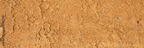background texture from the smooth surface of the sand. top view. banner