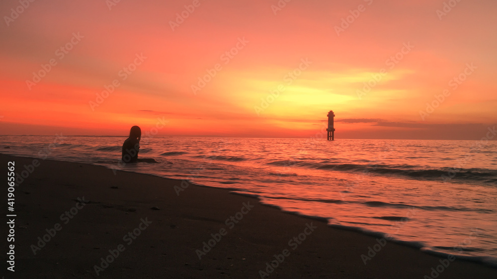 A Girl Waiting for very warm sunset in Tropical Island, Lombok.
The sister of Bali Indonesia.