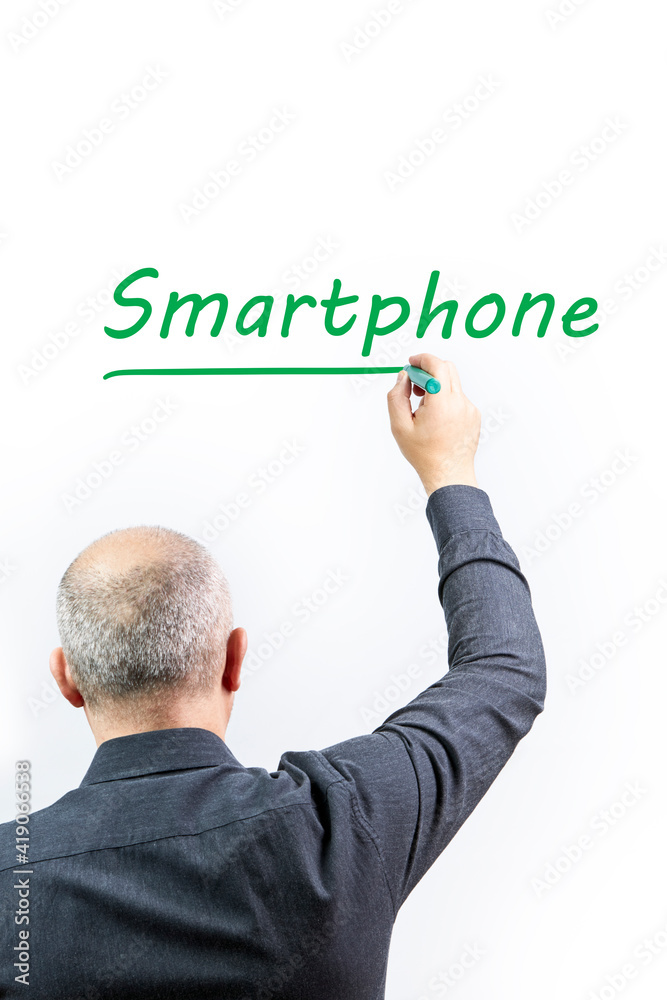 Man writing the word Smartphone on a white background with a green pen