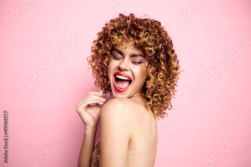Charming model Curly hair bright makeup closed eyes fashionable clothes
