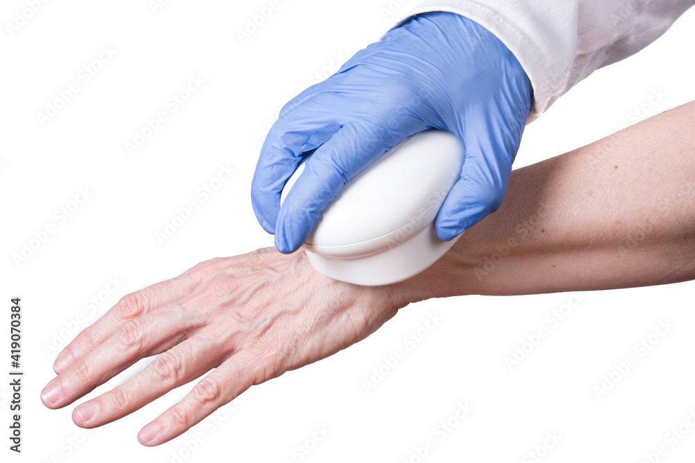 therapy. Woman heals hand with field, physiotherapy