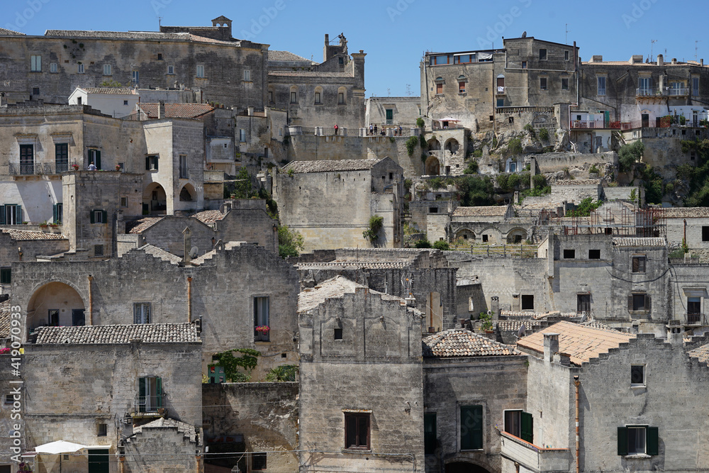 Sassi di Matera historic site cityscape with ancient cave dwellings, popular tourist travel place, guided tour concept, Basilicata, Italy