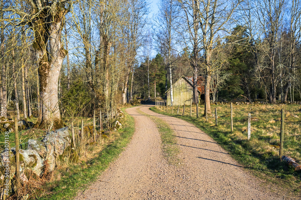 Winding gravel road in a rural country at spring Winding gravel road in a rural country at spring