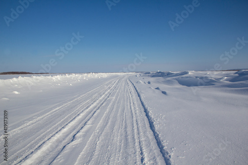 Ice road - travel north. Winter road is a winter road in the north.  © Илья Юрукин