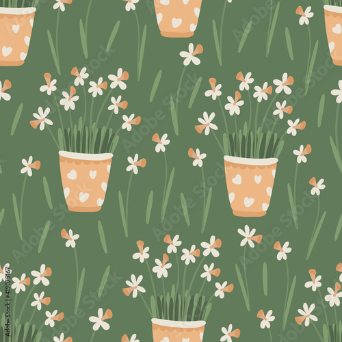 Spring floral seamless pattern. Daffodil or narcissus flowers in pots. Great for fabrics, wrapping papers, covers. Green background. Vector hand drawn illustration.