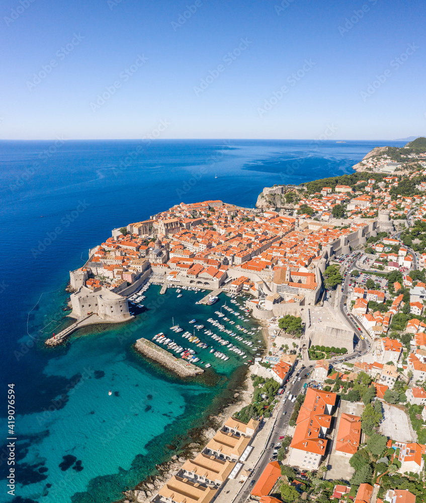 Aerial drone shot of Old Port in Dubrovnik old town in Croatia summer morning