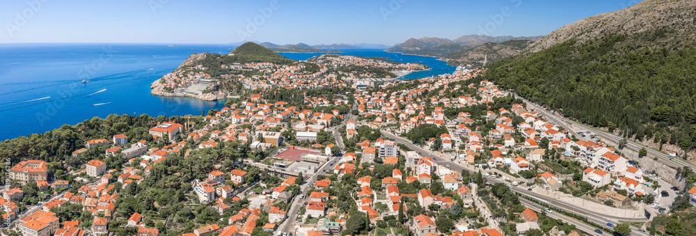 Aerial panorama drone shot of West Dubrovnik town by Adriatic sea in Croatia summer noon