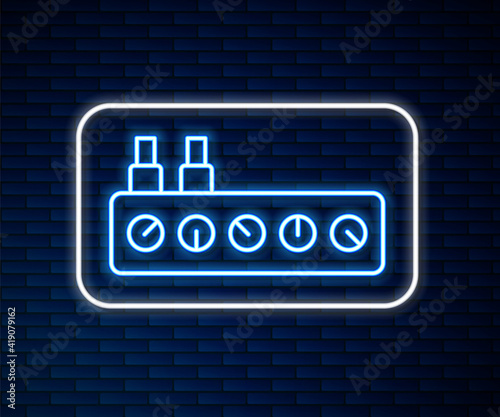 Glowing neon line Sound mixer controller icon isolated on brick wall background. Dj equipment slider buttons. Mixing console. Vector.
