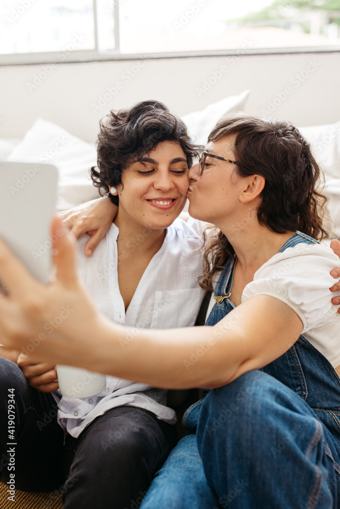 Lesbian couple taking selfie Lesbian couple taking selfie