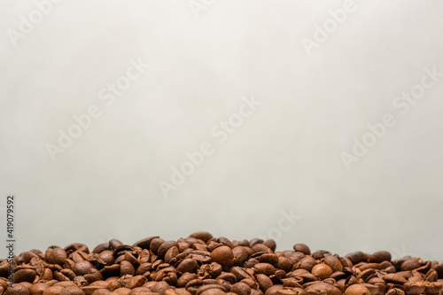 coffee beans on burlap background © benjamin