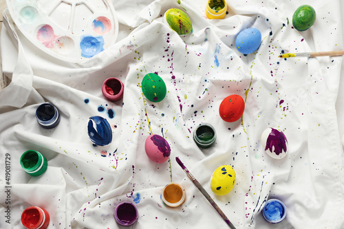 Easter colorful eggs and paints on a light background, decor, pattern