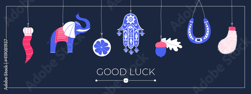 Lucky charms, symbols, amulets, talismans. Good luck symbols banner. Symbols of good fortune, prosperity and success hanging. Horseshoe, clover, rabbit foot, acorn, Fatima hand