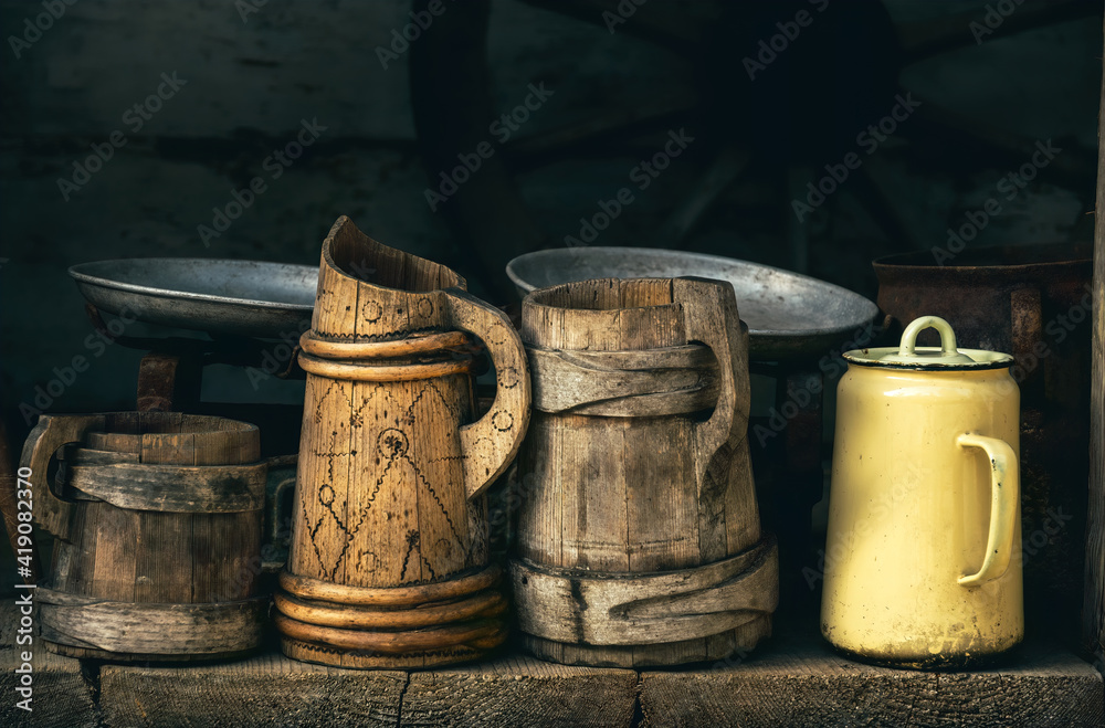 Old wooden beer mugs and jugs. Rustic antique tableware Old wooden beer mugs and jugs. Rustic antique tableware