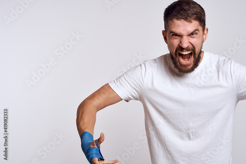 Sports man boxing bandages on hands emotions energy workout © SHOTPRIME STUDIO