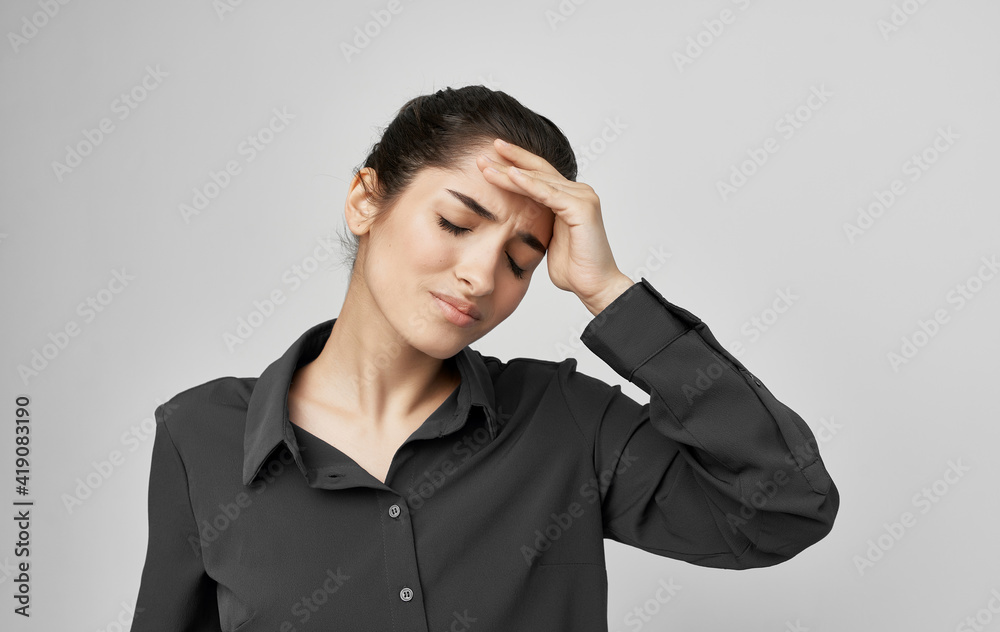 brunette in shirt holding face health problems discontent brunette in shirt holding face health problems discontent