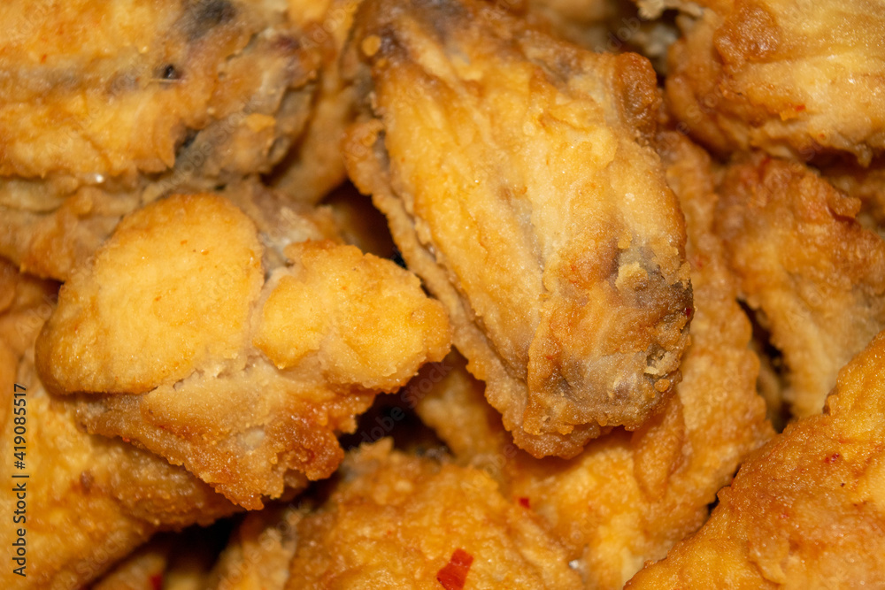 Small pieces of chicken meat with spices fried in breadcrumbs. Small pieces of chicken meat with spices fried in breadcrumbs.