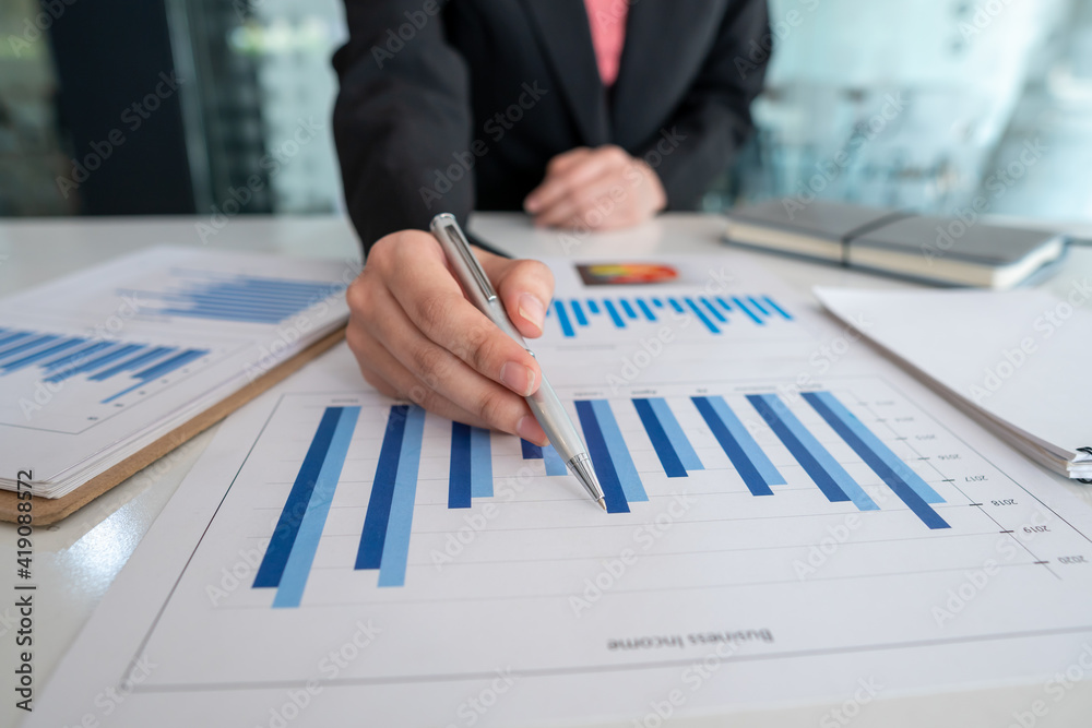 Business people checking charts, spreadsheets, graphs, financial development, bank accounts, economic statistics, data analysis, investment analysis, stock market Business people checking charts, spreadsheets, graphs, financial development, bank accounts, economic statistics, data analysis, investment analysis, stock market