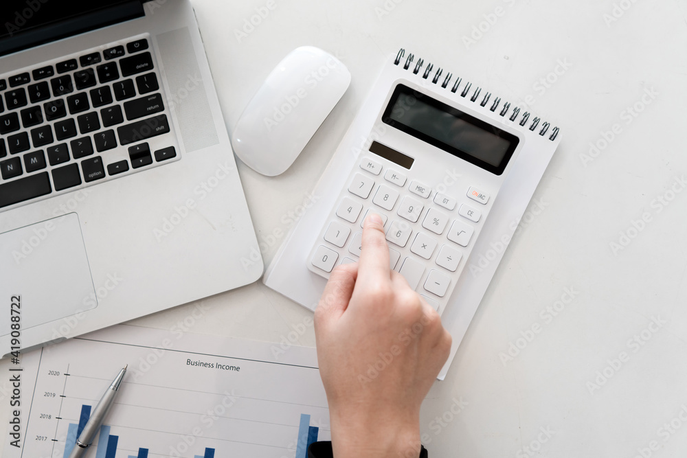 businessman working on desk office with using a calculator to calculate the numbers, finance accounting concept businessman working on desk office with using a calculator to calculate the numbers, finance accounting concept