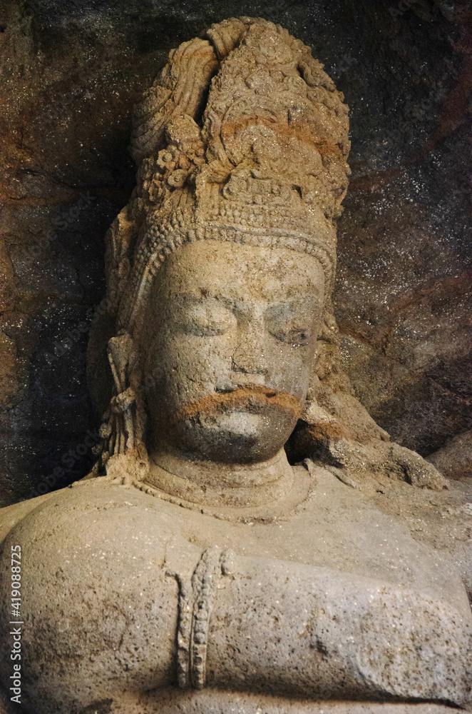 Carved idol of stone inside Cave 1, Elephanta Caves, Gharapuri island, Mumbai, Maharashtra, India Carved idol of stone inside Cave 1, Elephanta Caves, Gharapuri island, Mumbai, Maharashtra, India