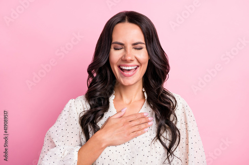 Photo of satisfied young girl closed eyes arm on chest laughing loud wear retro isolated on pink color background