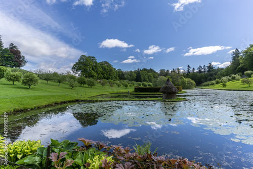 Garden and pond in White elegant Blair Castle locates near the village of Blair Atholl , one of the most tourist attractions in Scottish Highlands