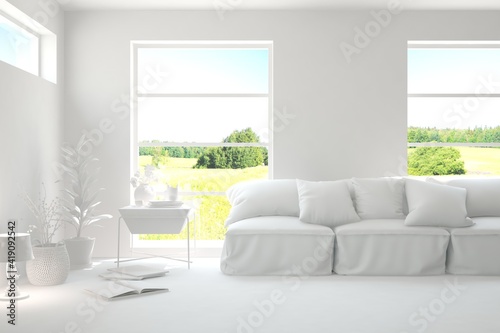 Mock up of stylish room in white color with sofa and green landscape in window. Scandinavian interior design. 3D illustration