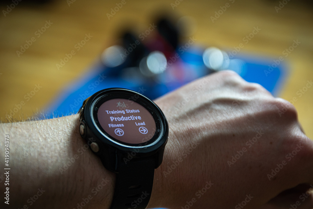 Workout at home. Close up shot of smartwatch which shows productive training. Sport watch shows info about workouts. Workout at home. Close up shot of smartwatch which shows productive training. Sport watch shows info about workouts.