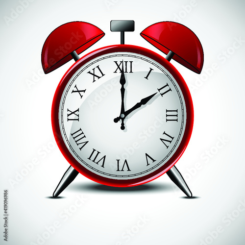 Close up of analog red alarm clock over white background
